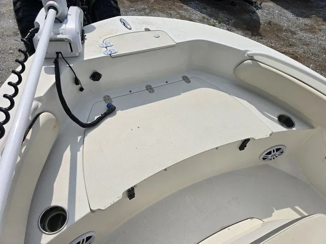 Slide: The Image of The image shows the deck of a 2023 Stingray 173 CC boat with rod holders and speakers. - 30