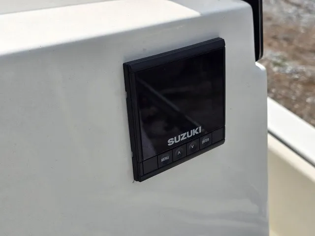 Slide: The Image of A Suzuki display screen is integrated into a boat's dashboard. - 23