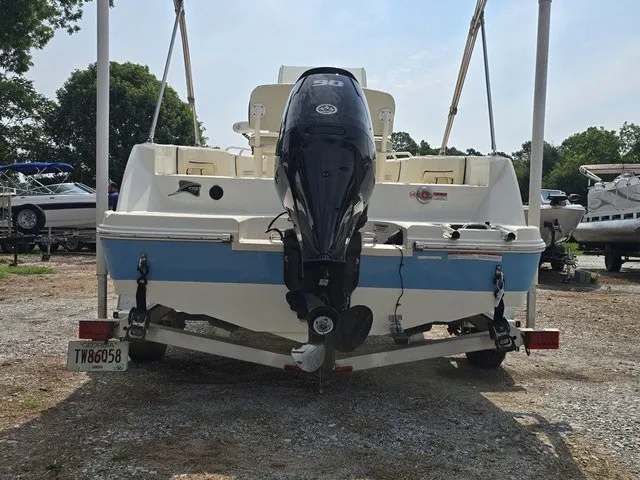Slide: The Image of A 2023 Stingray 173 CC boat on a trailer, featuring an outboard motor. - 5