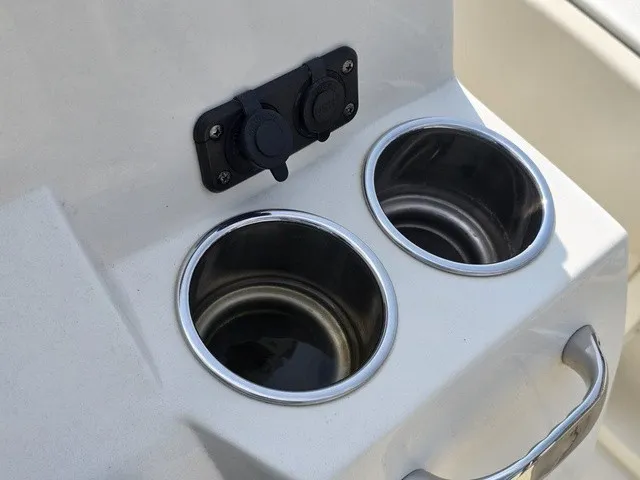 Slide: The Image of Two stainless steel cup holders on a boat with sockets above them. - 24