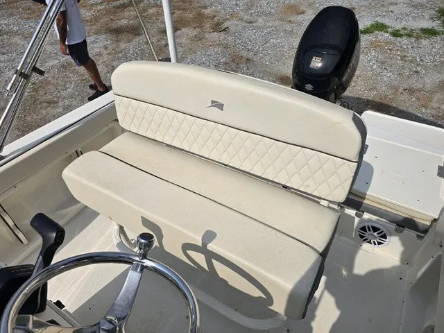 Slide: The Image of The image shows the seating area of a 2023 Stingray 173 CC boat with an outboard motor. - 27