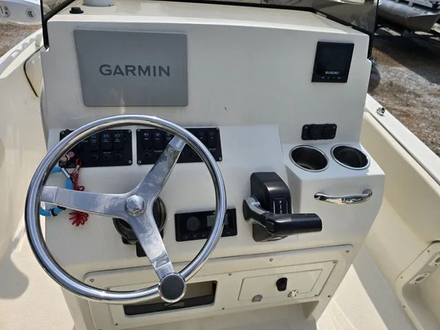Slide: The Image of The image shows a boat's helm with a Garmin navigation system and various controls. - 20