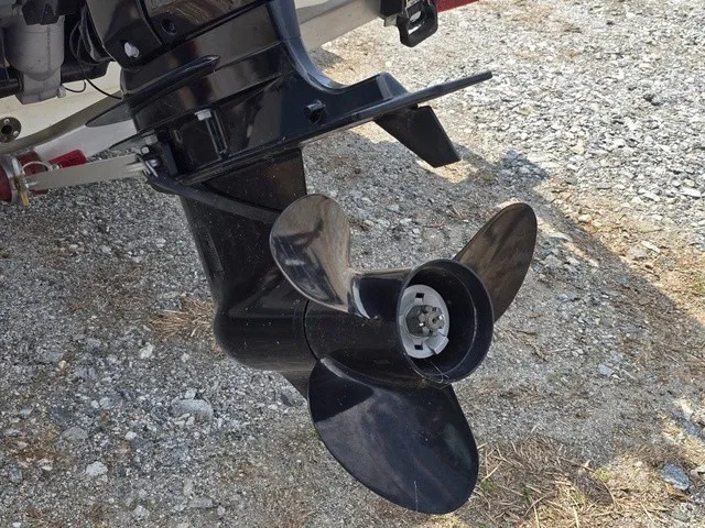 Slide: The Image of Close-up of a boat propeller on a gravel surface. - 17