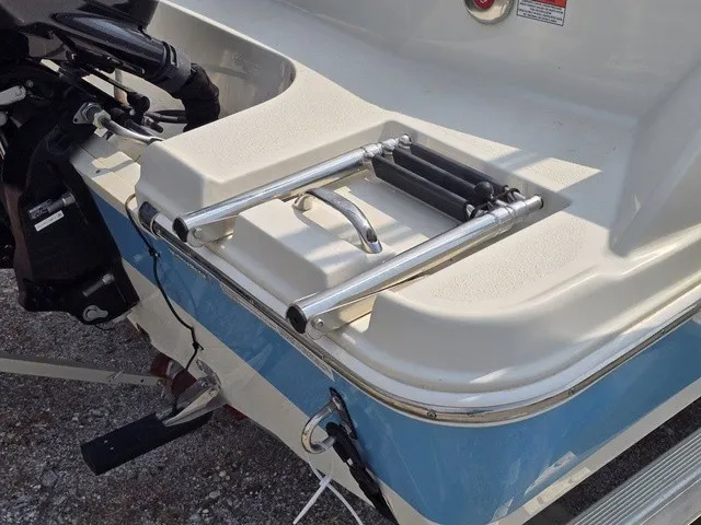 Slide: The Image of A 2023 Stingray 173 CC with a foldable swim ladder at the stern. - 14