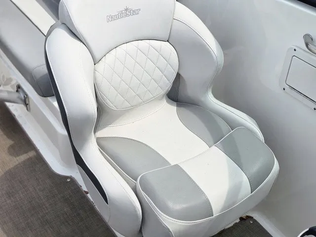 Slide: The Image of A luxurious, cushioned boat seat with gray and white upholstery and a quilted pattern. - 15