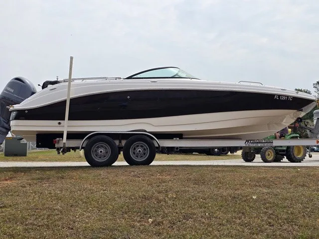 Slide: The Image of A 2022 NauticStar 243 DC boat on a trailer, ready for transport. - 7