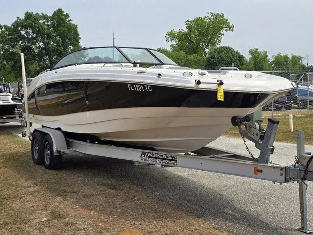 Slide: The Image of A 2022 NauticStar 243 DC boat on a trailer, ready for transport. - 8