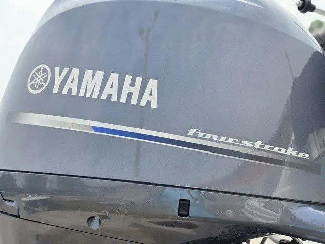 Slide: The Image of Yamaha outboard motor on a 2022 NauticStar 243 DC boat. - 32