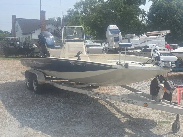 Slide: The Image of A 2012 Xpress H22B Bay boat is on a trailer in an outdoor lot. - 4
