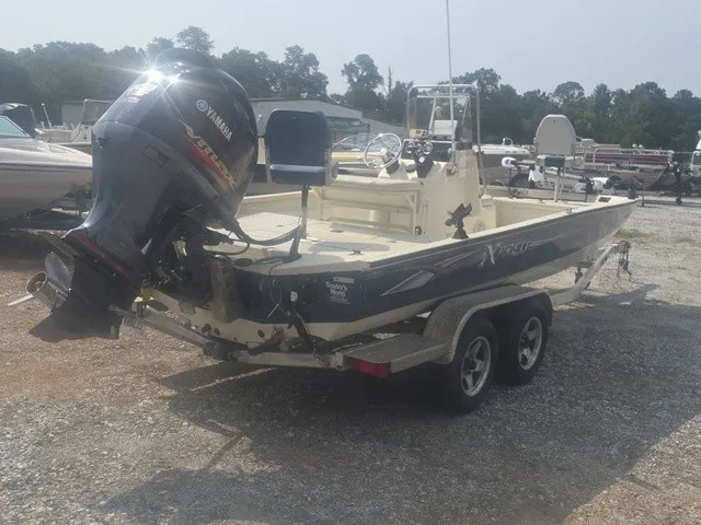 Slide: The Image of A 2012 Xpress H22B Bay boat on a trailer. It features a Yamaha outboard motor. - 6