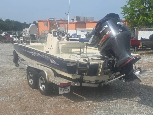 Slide: The Image of 2012 Xpress H22B Bay with Yamaha outboard motor on a trailer. - 9