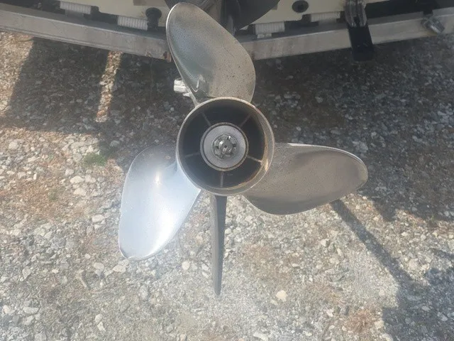 Slide: The Image of Close-up of a three-blade propeller on a gravel surface. - 12