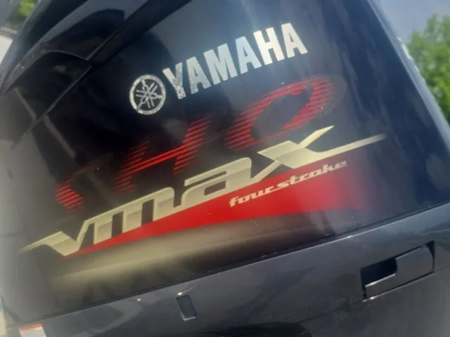 Slide: The Image of Close-up of a Yamaha 140 Vmax four-stroke outboard motor on a boat. - 11