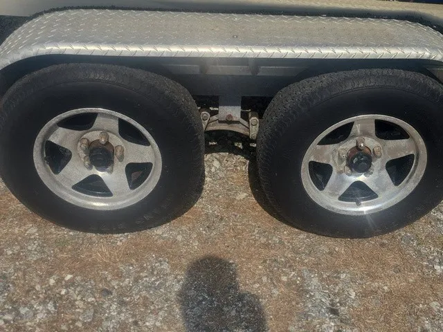 Slide: The Image of Close-up of two tires on a trailer with metal fender. - 29