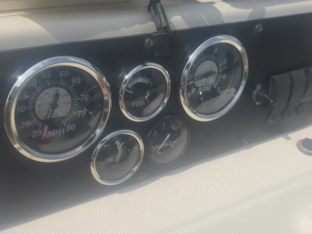 Slide: The Image of Close-up of a 2012 Xpress H22B Bay boat dashboard with speed and fuel gauges. - 17