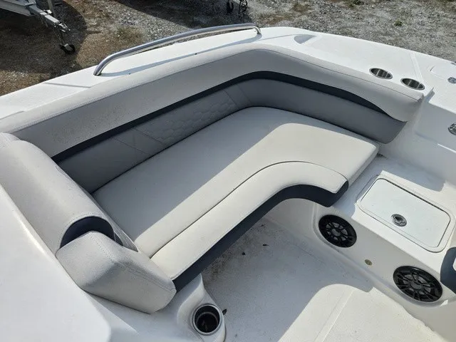 Slide: The Image of The image shows a white boat seating area with gray accents and built-in speakers. - 14