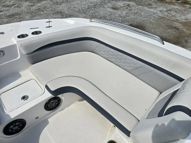 Slide: The Image of The image shows a white seating area with blue accents on a boat. - 15