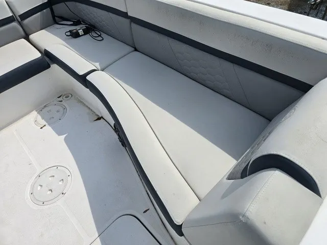Slide: The Image of The image shows the seating area of a 2021 Hurricane SunDeck Sport 192 RL OB with gray upholstery. - 18