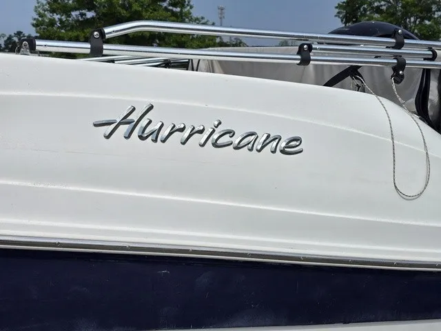 Slide: The Image of Close-up of the "Hurricane" logo on the side of a white boat. - 8