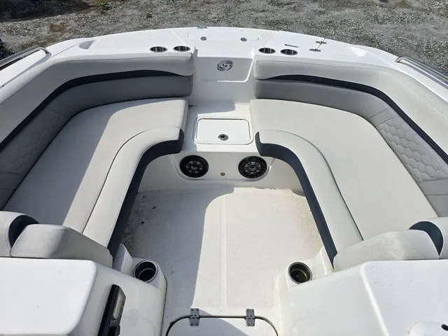 Slide: The Image of The image shows the bow area of a 2021 Hurricane SunDeck Sport 192 RL OB boat with cushioned seating. - 13