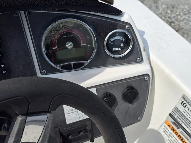 Slide: The Image of Close-up of a boat dashboard with a speedometer and fuel gauge. - 24