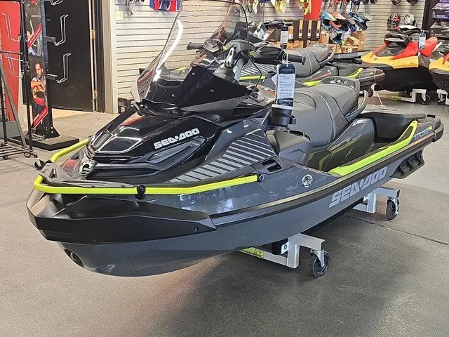 Slide: The Image of A gray 2026 Sea-Doo Explorer Pro is displayed in a showroom on a rolling stand. - 2