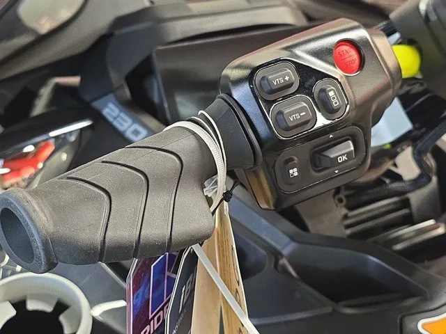 Slide: The Image of Close-up of a Sea-Doo Explorer Pro 2026 handlebar with control buttons and tags. - 12