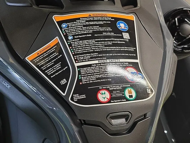 Slide: The Image of Close-up of a Sea-Doo Explorer Pro 2026 console with safety and operation instructions. - 14