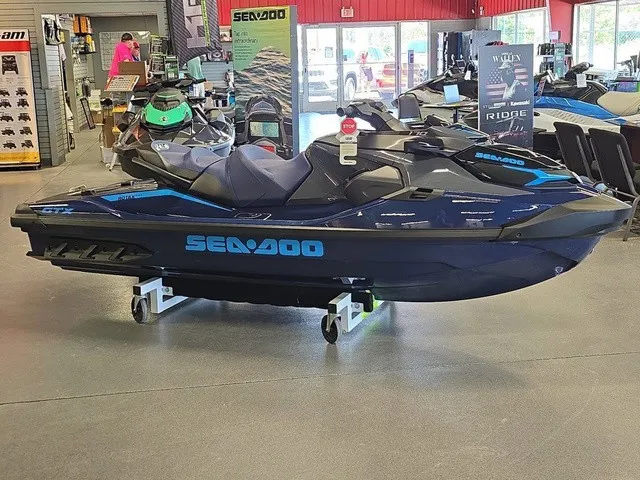 Slide: The Image of A 2026 Sea-Doo GTX 170 jet ski is displayed in a showroom on a rolling cart. - 5