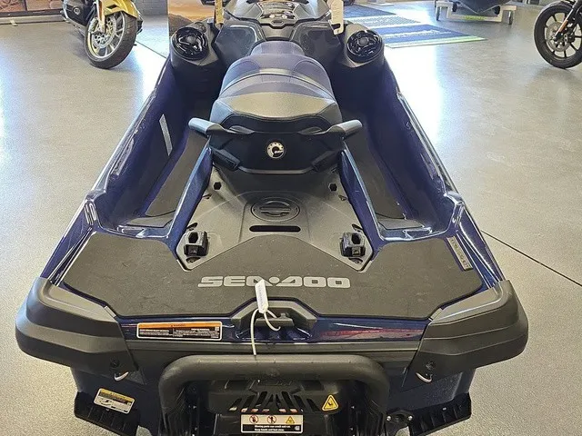 Slide: The Image of A 2026 Sea-Doo GTX 170 jet ski in a showroom, featuring a blue seat and black hull. - 20