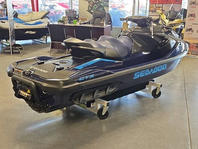 Slide: The Image of A 2026 Sea-Doo GTX 170 jet ski is displayed on a dolly in a showroom. - 6