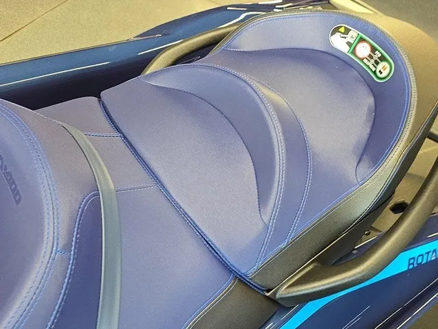 Slide: The Image of Close-up of a blue Sea-Doo GTX 170 seat with ergonomic design and safety sticker. - 18