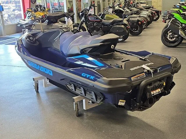 Slide: The Image of A 2026 Sea-Doo GTX 170 jet ski is in a showroom, surrounded by motorcycles. - 8
