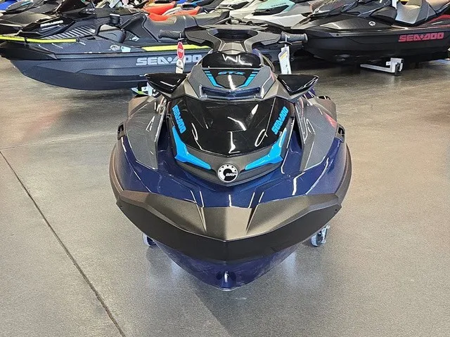Slide: The Image of A 2026 Sea-Doo GTX 170 jet ski in a showroom, surrounded by other watercraft. - 3
