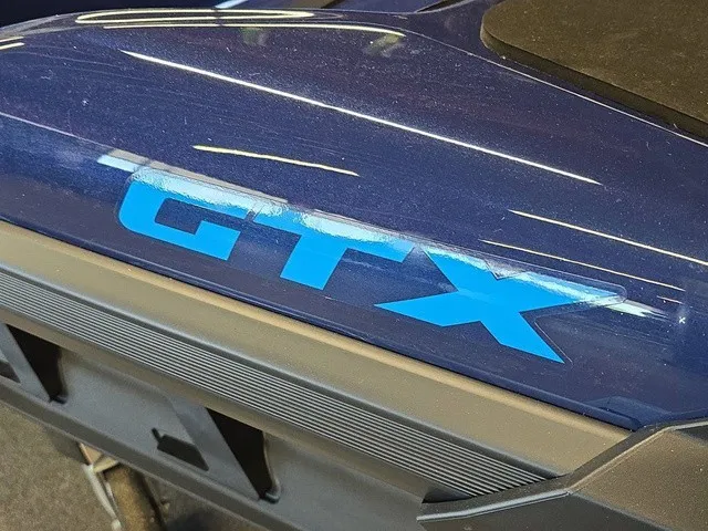 Slide: The Image of Close-up of the 2026 Sea-Doo GTX 170 with blue GTX logo on a dark blue surface. - 22
