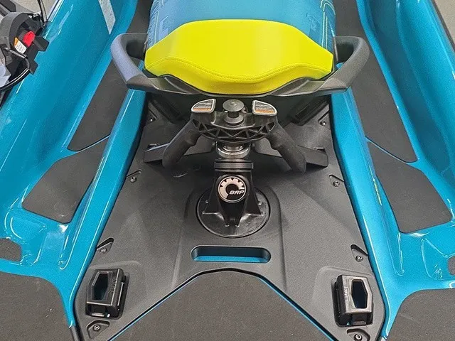 Slide: The Image of Close-up of the control area of a Sea-Doo Wake Pro 230 jet ski with blue and yellow seat. - 20