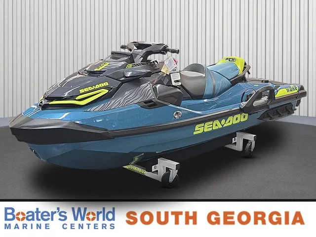 The Image of A 2026 Sea-Doo Wake Pro 230 jet ski is displayed in a showroom on a dolly. - 1