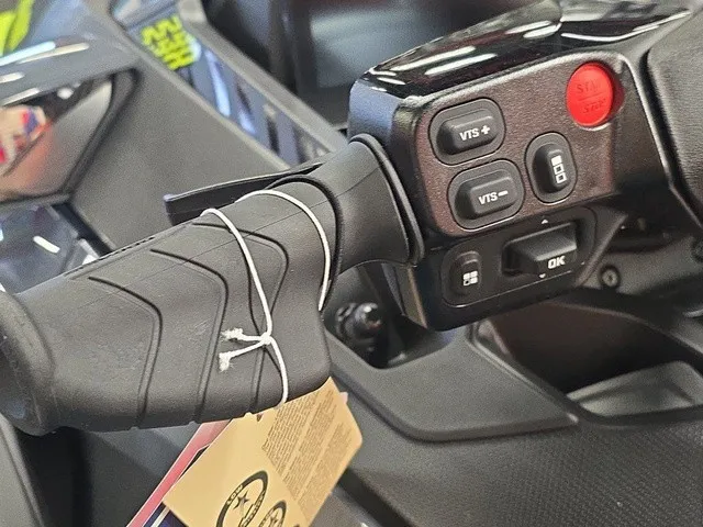 Slide: The Image of Close-up of a Sea-Doo Wake Pro 230 handlebar with control buttons and a tag. - 13