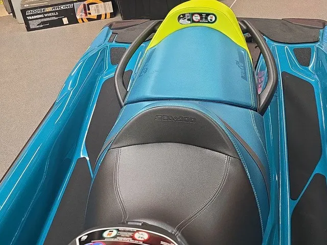 Slide: The Image of A 2026 Sea-Doo Wake Pro 230 with blue and green seat design. - 18