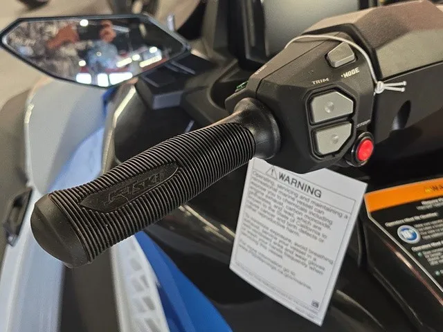 Slide: The Image of Close-up of the handlebar on a 2026 Kawasaki Jet Ski STX with warning labels. - 16