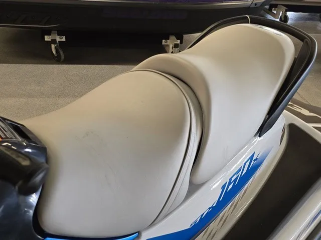 Slide: The Image of Close-up of a Kawasaki Jet Ski STX seat with blue accent. - 19