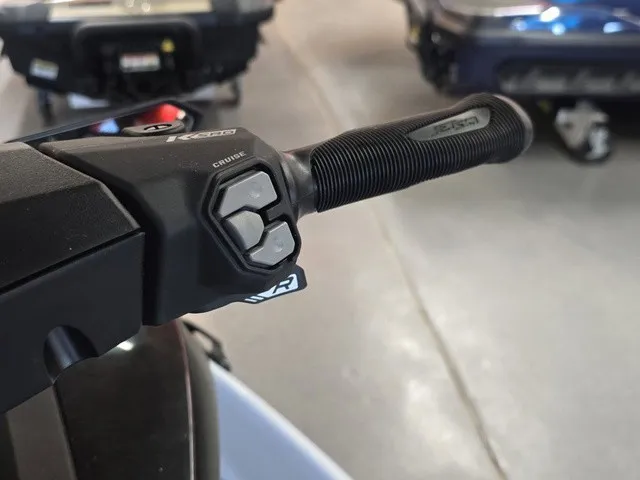 Slide: The Image of Close-up of a Kawasaki Jet Ski STX handlebar with control buttons. - 17