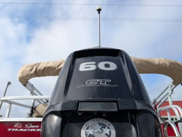 Slide: The Image of Close-up of a 60 HP engine on a 2025 Sun Tracker Party Barge 18 DLX. - 28