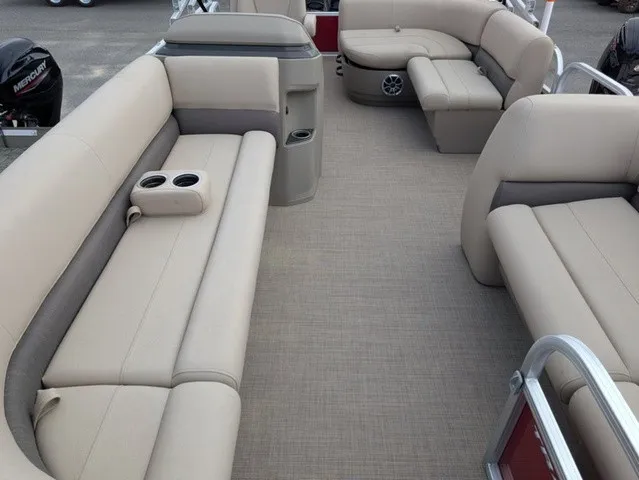 Slide: The Image of The image shows the interior of a 2025 Sun Tracker Party Barge 18 DLX with beige seating. - 8