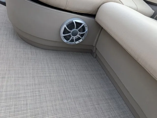 Slide: The Image of Close-up of a speaker in a boat with beige upholstery and carpeted flooring. - 20