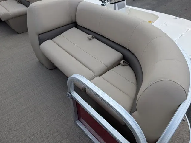 Slide: The Image of A sleek, cream-colored sofa on a boat with gray carpeting and metal railing. - 9