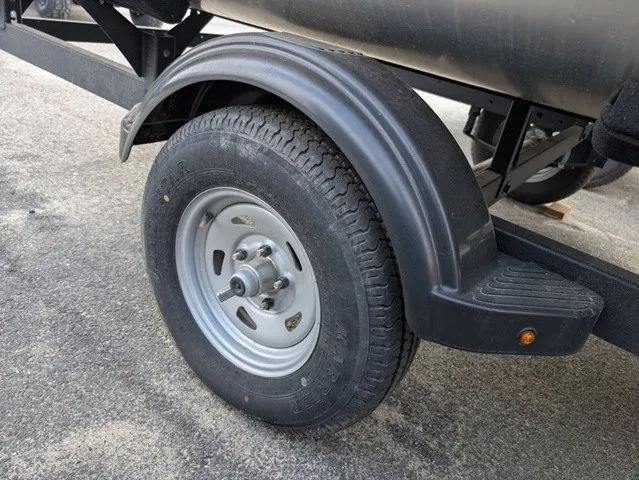 Slide: The Image of Close-up of a boat trailer with a sturdy tire and fender. - 24