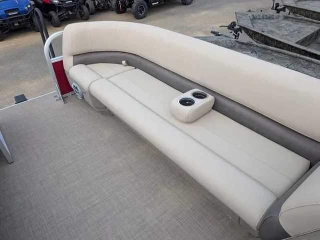 Slide: The Image of The image shows a beige seating area on a boat with built-in cup holders. - 11