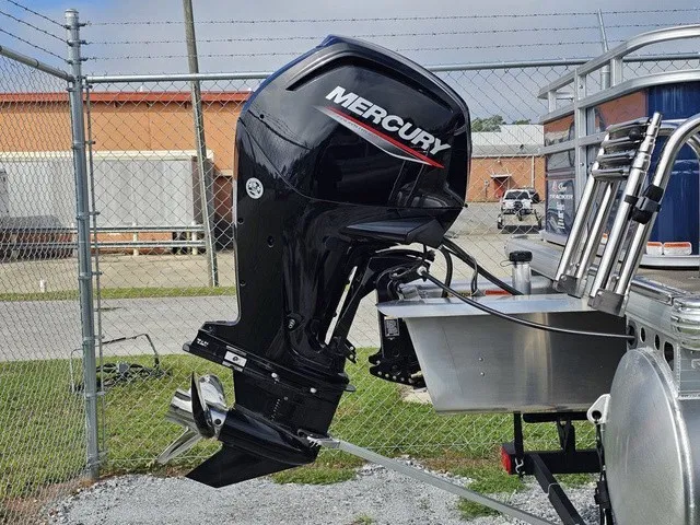 Slide: The Image of A Mercury outboard motor is mounted on a Sun Tracker Fishin' Barge 20 DLX boat. - 5