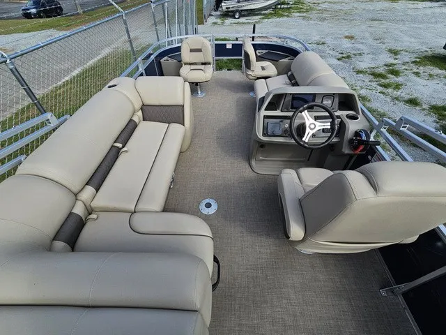 Slide: The Image of 2025 Sun Tracker Fishin' Barge 20 DLX with spacious seating area and helm. - 31
